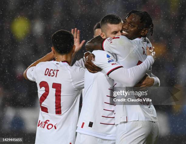 Ante Rebic of AC Milan celebrates with Rafael Leao after scoring the opening goal during the Serie A match between Empoli FC and AC MIlan at Stadio...