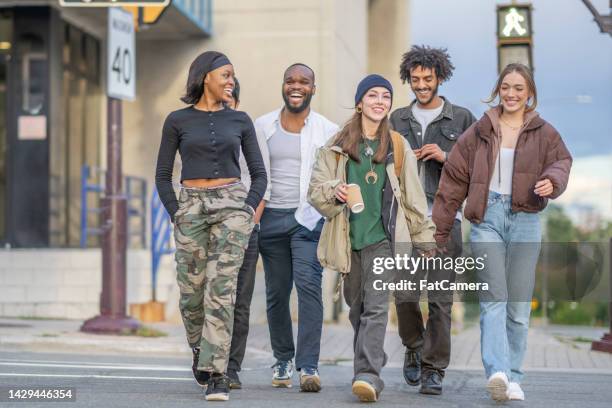 youth walking downtown - 19 to 22 years and friends and talking stock pictures, royalty-free photos & images