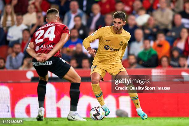 Martin Valjent of Mallorca competes for the ball with Ferran Torres of Barcelona during the LaLiga Santander match between RCD Mallorca and FC...