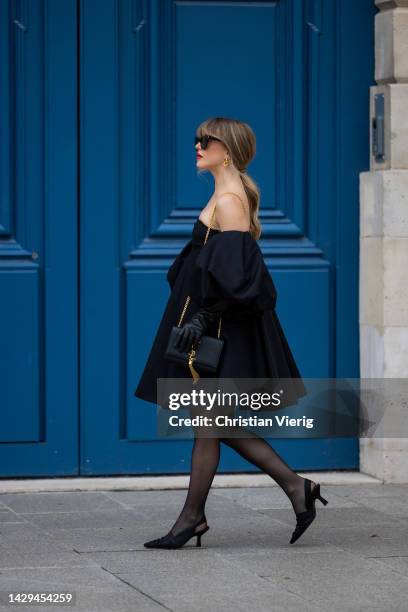 Julianne Hough wears Khaite dress and shoes, Valentino gloves, Saint Laurent bag, olford tights during the Paris Fashion Week - Womenswear...