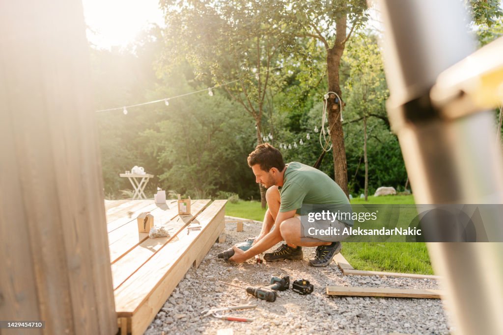 Carpenter installing decking boards