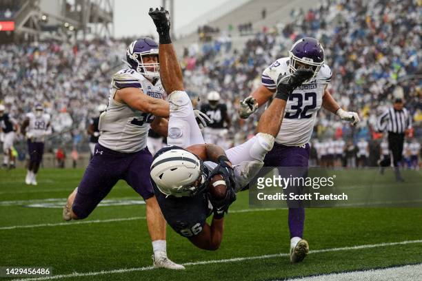 Brenton Strange of the Penn State Nittany Lions leaps to score a touchdown against the Northwestern Wildcats during the first half at Beaver Stadium...