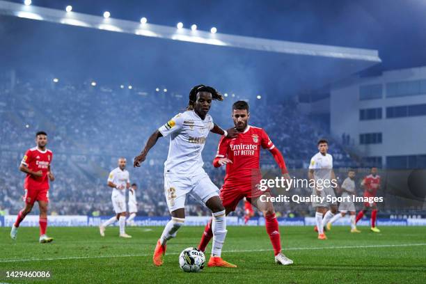 Rafa Silva of SL Benfica competes for the ball with Ibrahima Bamba of Vitoria Guimaraes SC during the Liga Portugal Bwin match between Vitoria...