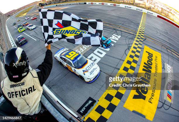 Allmendinger, driver of the Action Industries Chevrolet, takes the checkered flag to win the NASCAR Xfinity Series Sparks 300 at Talladega...