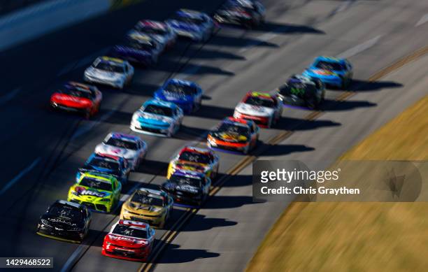 Sheldon Creed, driver of the Whelen Chevrolet, and Trevor Bayne, driver of the Dollar Concrete Toyota, lead the field during the NASCAR Xfinity...