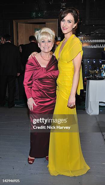 Barbara Windsor and Katherine Kelly pose in the Olivier Awards 2012 press room at The Royal Opera House on April 15, 2012 in London, England.