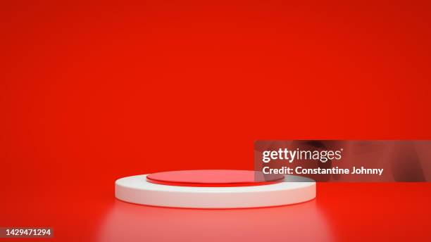 podium on red background. christmas theme - advertising column stock-fotos und bilder
