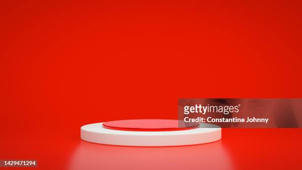 podium on red background. christmas theme - advertising column - fotografias e filmes do acervo