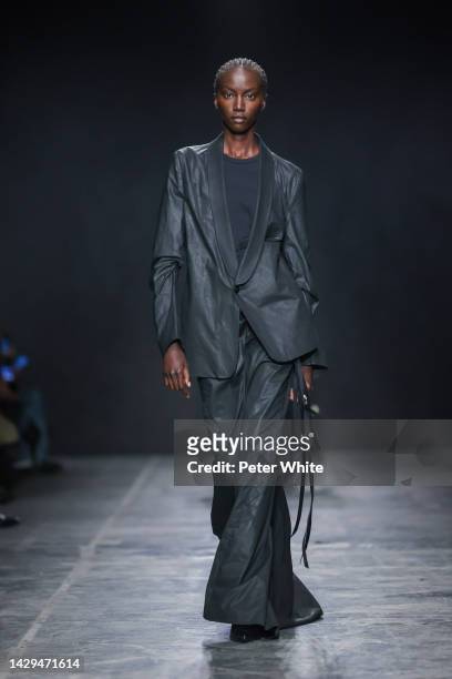 Anok Yai walks the runway during the Ann Demeulemeester Womenswear Spring/Summer 2023 show as part of Paris Fashion Week on October 01, 2022 in...