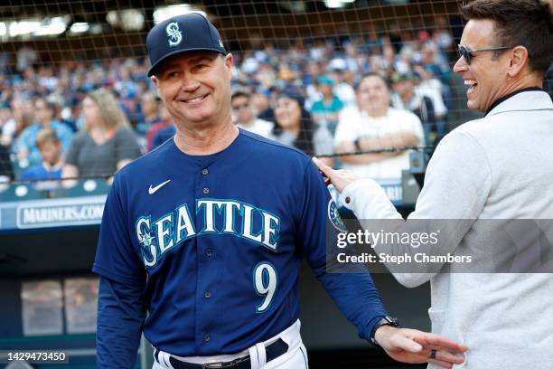 Manager Scott Servais and general manager Jerry Dipoto of the Seattle Mariners look on before the game against the Oakland Athletics at T-Mobile Park...
