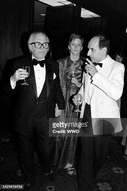 Richard Attenborough, Alison Sutcliffe, and Ben Kinglsey attend an event at the Century Plaza Hotel in Century City, California, on December 9, 1982.