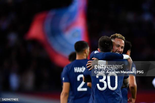 Leo Messi of Paris Saint-Germain is congratulated by Neymar Jr after scoring during the Ligue 1 match between Paris Saint-Germain and OGC Nice at...