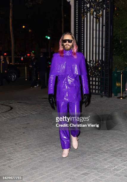 Jared Leto wears purple cape, jacket, pants, black gloves, rose ankle boots outside BOF 500 GALA during the Paris Fashion Week - Womenswear...