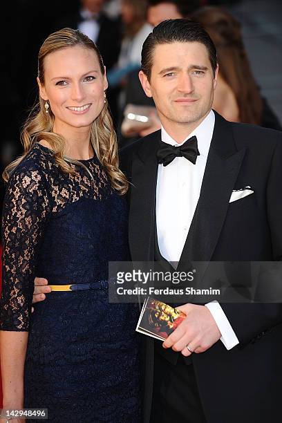 Tom Chambers and his wife Clare Harding arrive at the Olivier Awards at The Royal Opera House on April 15, 2012 in London, England.