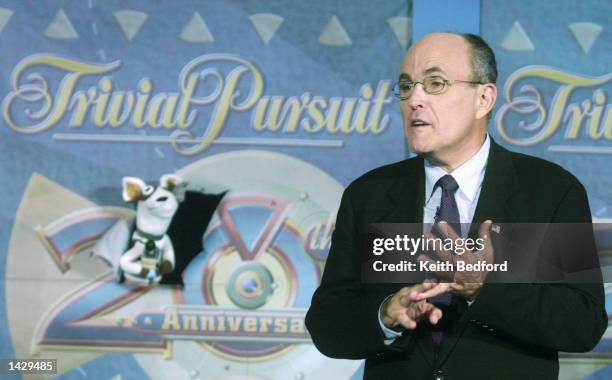 Former New York Mayor Rudy Giuliani speaks to the Pets.Com sock puppet during an event celebrating the release of the 20th anniversary edition of the...