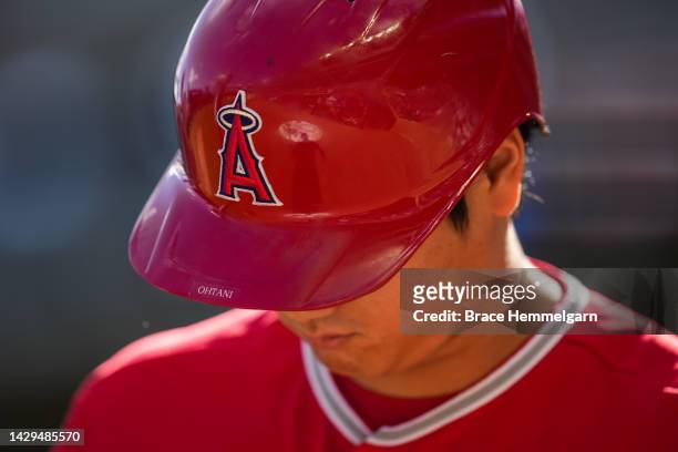 Detail view of the helmet of Shohei Ohtani of the Los Angeles Angels looks on against the Minnesota Twins on September 25, 2022 at Target Field in...