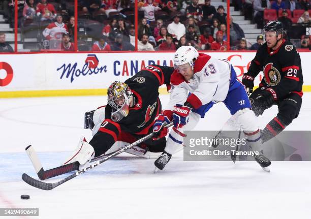 Mads Sogaard of the Ottawa Senators makes a stick save against Mitchell Stephens of the Montreal Canadiens in the second period as Dillon...