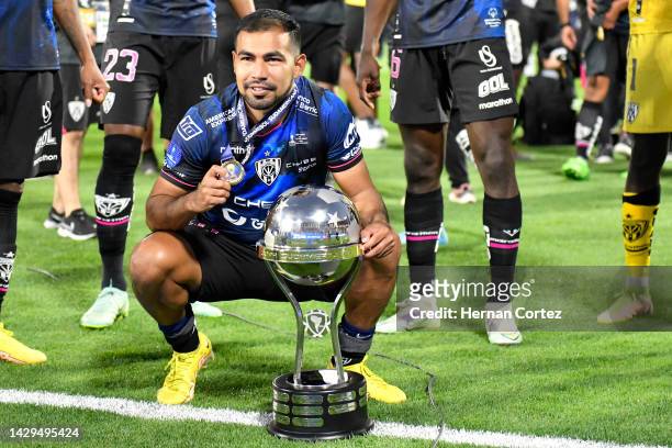 Junior Sornoza of Independiente del Valle poses with his first place medal and the trophy after the Copa CONMEBOL Sudamericana 2022 Final match...