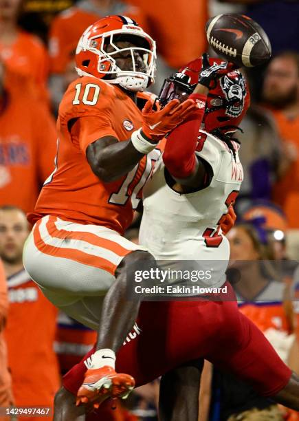 Aydan White of the North Carolina State Wolfpack blocks a pass intended for Joseph Ngata of the Clemson Tigers in the second quarter of the game at...