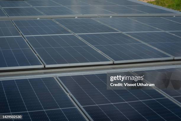 solar panels on the factory roof,industrial buildings in the background. - silicon stock pictures, royalty-free photos & images