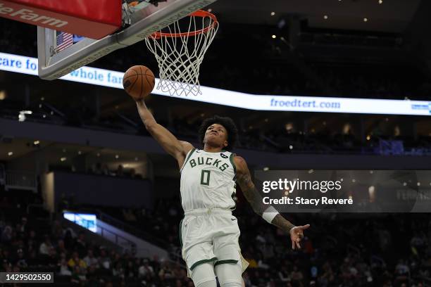 MarJon Beauchamp of the Milwaukee Bucks dunks during the second half of a preseason game against the Memphis Grizzlies at Fiserv Forum on October 01,...
