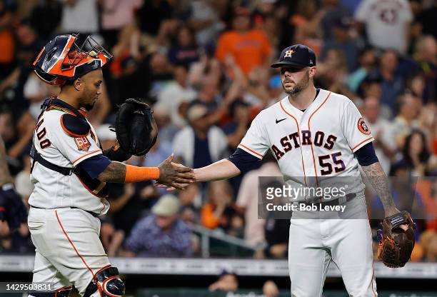 Ryan Pressly of the Houston Astros shakes hands with Martin Maldonado as they defeat the Tampa Bay Rays at Minute Maid Park on October 01, 2022 in...