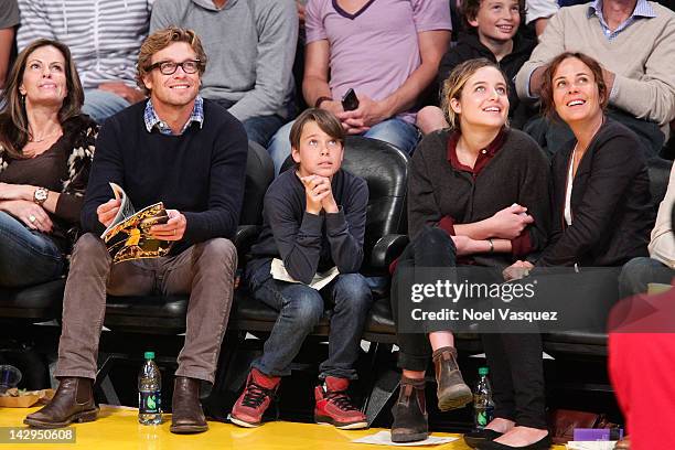 Simon Baker, Claude Blu, Stella Breeze and Rebecca Rigg attend a basketball game between the Dallas Mavericks and the Los Angeles Lakers at Staples...