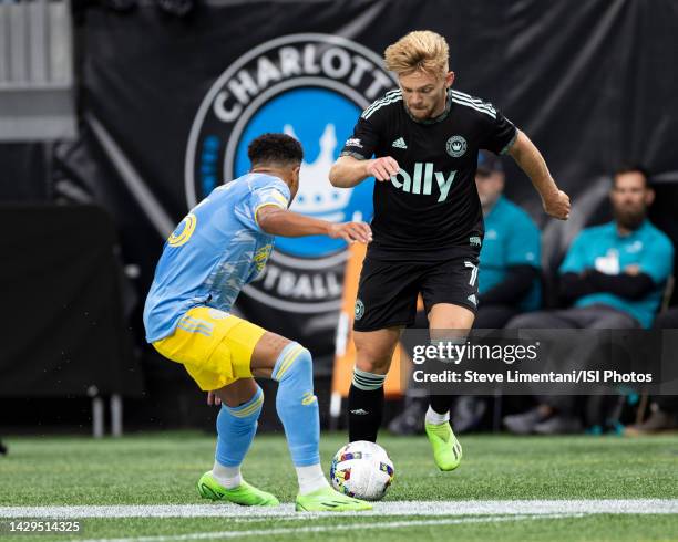 Kamil Jóźwiak of Charlotte FC tries to get around Nathan Harriel of Philadelphia Union during the game at Bank of America Stadium on October 1, 2022...