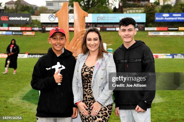 Jonah Lomu's family members Brayley Lomu, Nadene Quirk and Dhyreille Lomu pose for a photo with the Jonah Tali Lomu memorial trophy during the round...