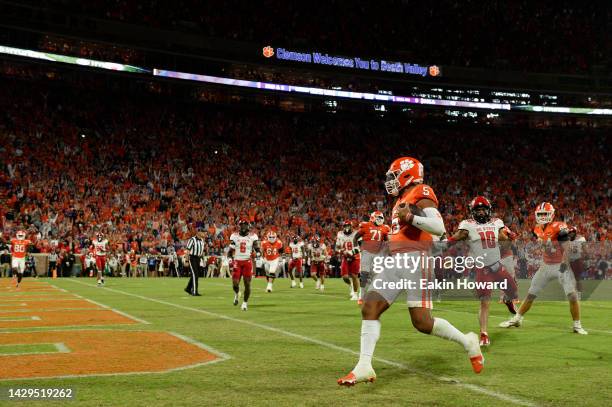 Uiagalelei of the Clemson Tigers scores a fourth quarter touchdown against the North Carolina State Wolfpack at Memorial Stadium on October 01, 2022...