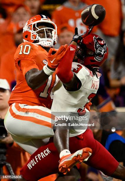 Aydan White of the North Carolina State Wolfpack blocks a pass intended for Joseph Ngata of the Clemson Tigers in the second quarter of the game at...