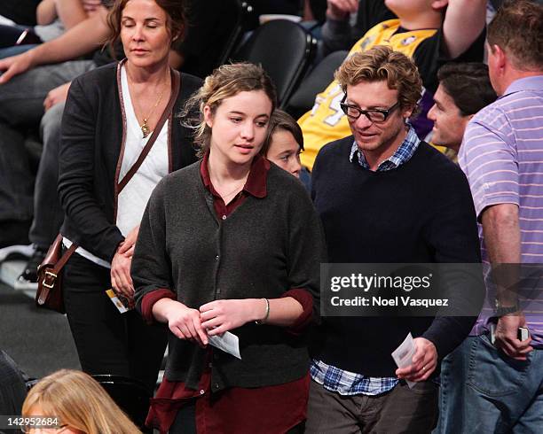 Rebecca Rigg, Stella Breeze, Claude Blu and Simon Baker attend a basketball game between the Dallas Mavericks and the Los Angeles Lakers at Staples...