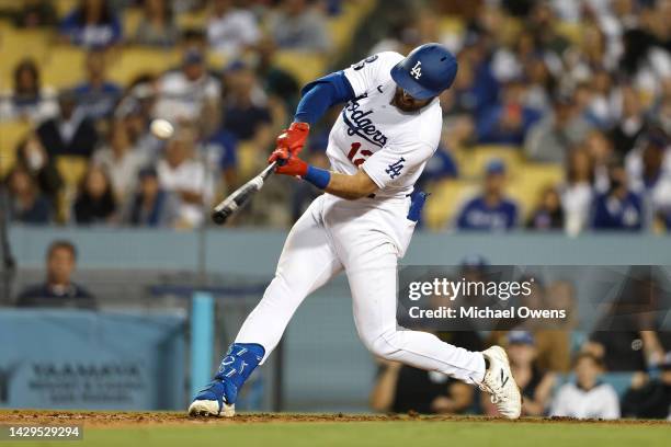 Joey Gallo of the Los Angeles Dodgers hits a sacrifice fly ball to center to take the lead, 5-4, against the Colorado Rockies during the eighth...