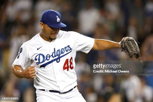 Brusdar Graterol of the Los Angeles Dodgers reacts after closing out to defeat the Colorado Rockies, 6-4, in the ninth inning at Dodger Stadium on...