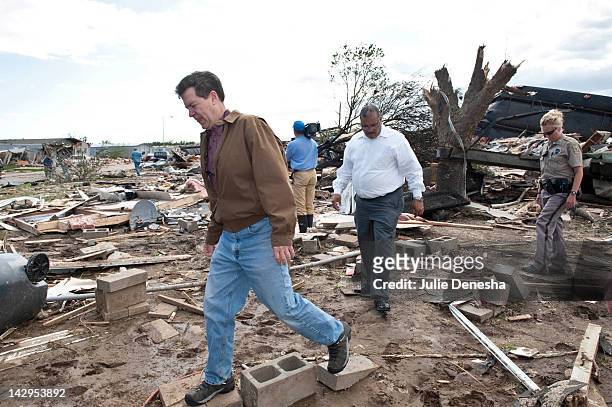 Kansas Gov. Sam Brownback and Wichita Mayor Carl Brewer tour the tornado-damaged Pinaire Mobile Home Park on April 15, 2012 in Wichita, Kansas. The...