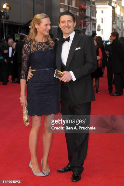 Tom Chambers and Clare Harding attend the 2012 Olivier Awards at The Royal Opera House on April 15, 2012 in London, England.