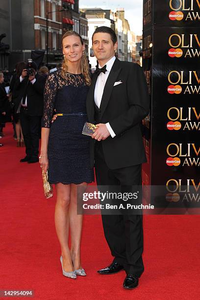 Tom Chambers and Clare Harding attend the 2012 Olivier Awards at The Royal Opera House on April 15, 2012 in London, England.