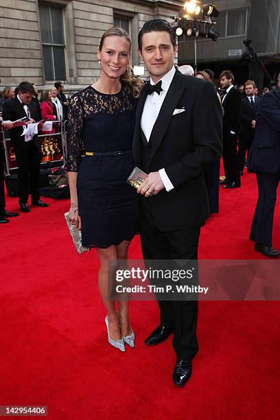 Tom Chambers and Clare Harding attend the 2012 Olivier Awards at The Royal Opera House on April 15, 2012 in London, England.