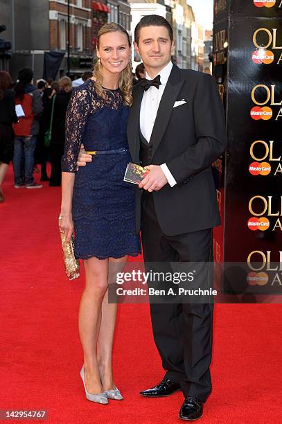 Clare Harding and Tom Chambers arrives at the Olivier Awards at The Royal Opera House on April 15, 2012 in London, England.