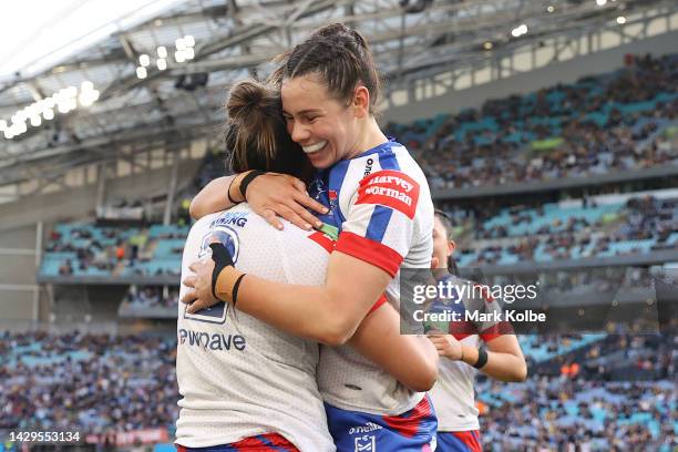 Kiana Takairangi of the Knights celebrates with team mate Shanice Parker of the Knights after scoring a try during the NRLW Grand Final match between...