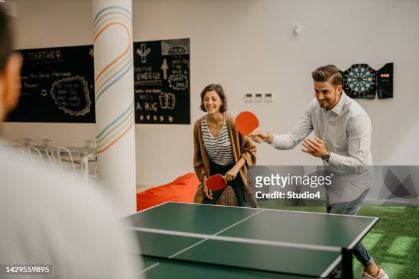 having some fun at the office - table tennis stock pictures, royalty-free photos & images