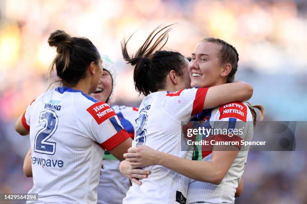 Kiana Takairangi, Shanice Parker and Tamika Upton of the Knights celebrate winning the NRLW Grand Final match between Newcastle Knights and...