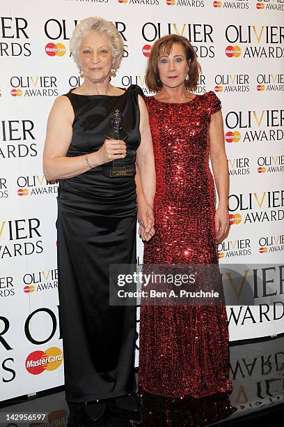 Special Award winner Dame Monica Mason and presenter Zoe Wanamaker pose in the press room during the 2012 Olivier Awards at The Royal Opera House on...