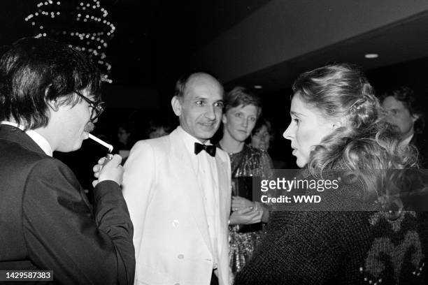 Guest, Ben Kingsley, Alison Sutcliffe, and Joan Hackett attend an event at the Century Plaza Hotel in Century City, California, on December 9, 1982.
