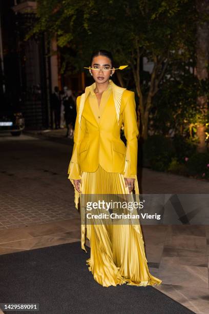 Bretman Rock wears yellow blazer, pleated skirt wide leg pants outside BOF 500 GALA during the Paris Fashion Week - Womenswear Spring/Summer 2023 -...