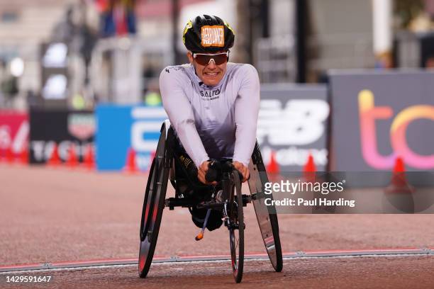 Catherine Debrunner of Switzerland finishes in first place in the Elite Women's Wheelchair Race during the 2022 TCS London Marathon on October 02,...