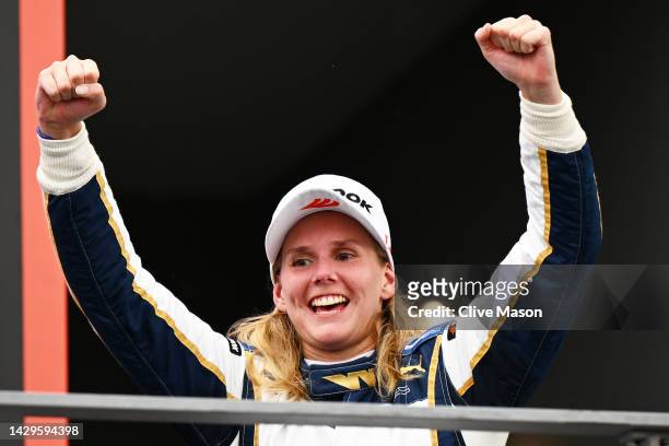 Race winner Beitske Visser of Netherlands and Sirin Racing celebrates on the podium during the W Series Round 6 race at Marina Bay Street Circuit on...
