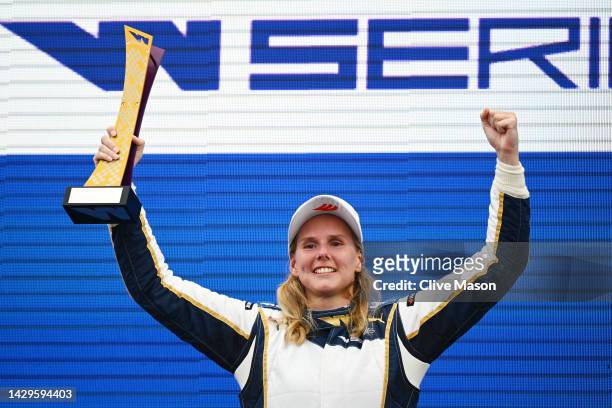 Race winner Beitske Visser of Netherlands and Sirin Racing celebrates on the podium during the W Series Round 6 race at Marina Bay Street Circuit on...