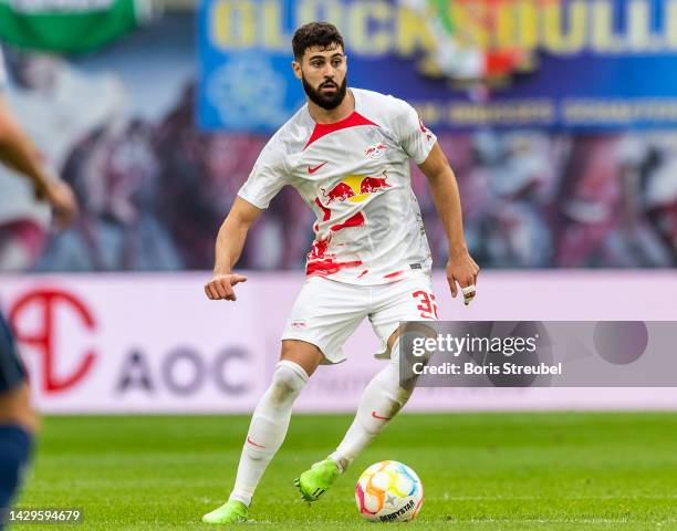 Josko Gvardiol of RB Leipzig runs with the ball during the Bundesliga match between RB Leipzig and VfL Bochum 1848 at Red Bull Arena on October 01,...