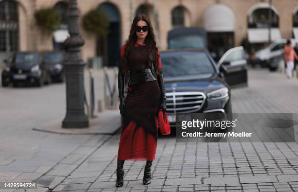 Sabina Jakubowicz seen wearing a Loewe dress with a bag by Coperni, Balenciaga sunglasses and shoes by Yves Saint Laurent, outside Loewe during Paris...